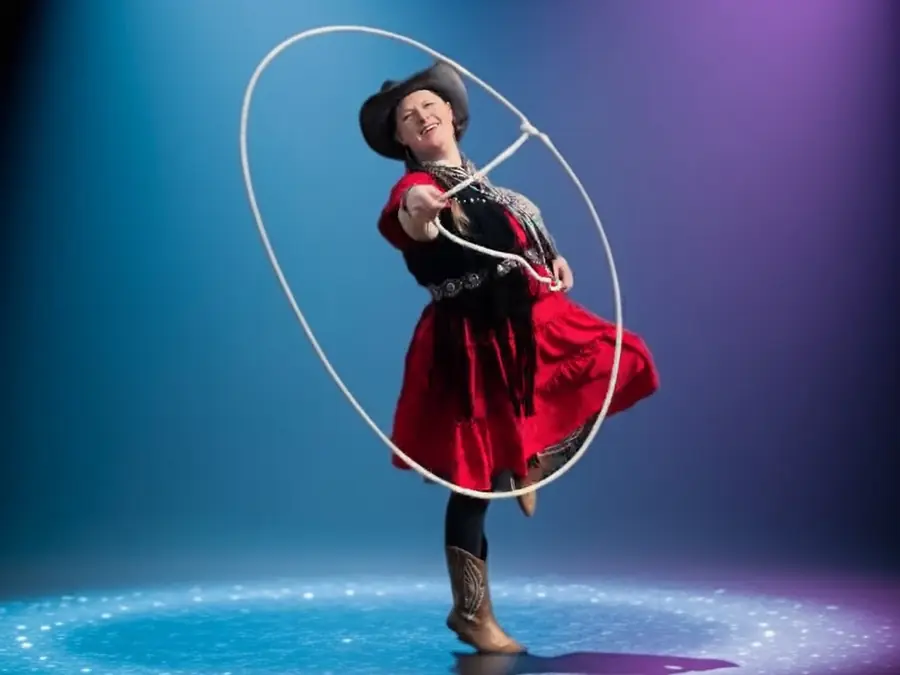 Western Christmas party entertainer spinning a lasso, Utah