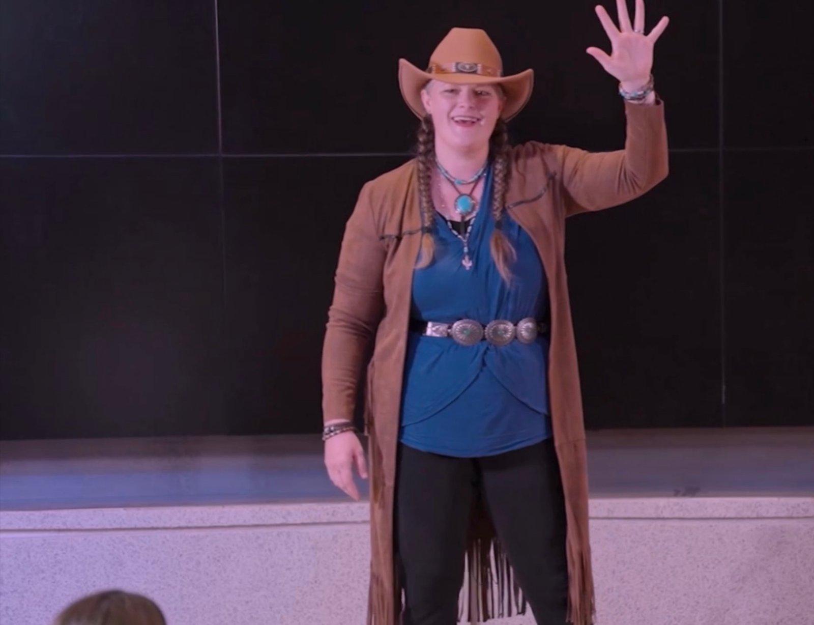 Kristen J. Lloyd, Northern Utah keynote speaker, performing on stage