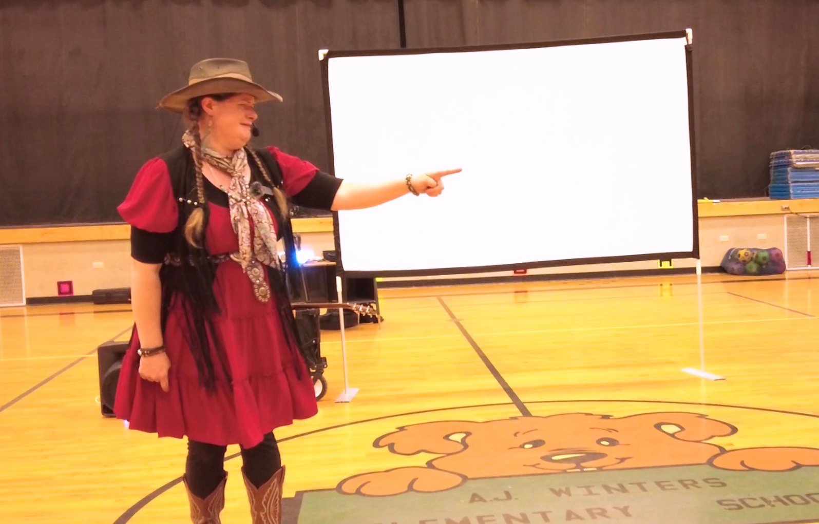 Kristen J. Lloyd telling a story during a Northern Utah Find Your Brave school assembly